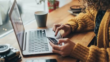 african american woman online shopping on smartphone