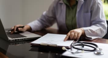Medical professional at table