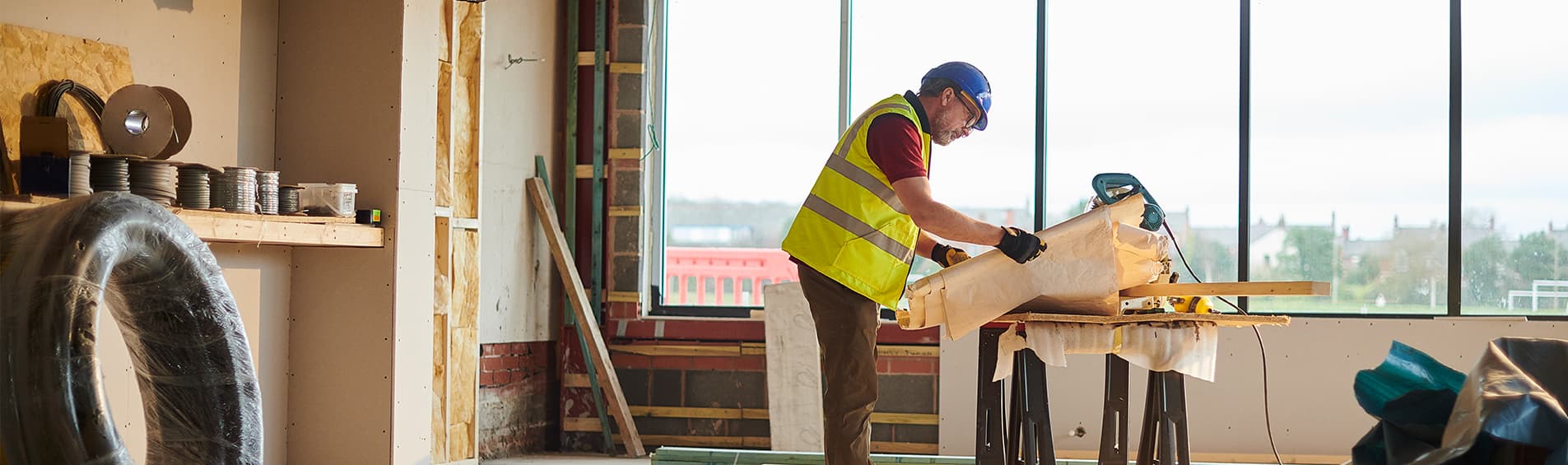 Builder checking his plans